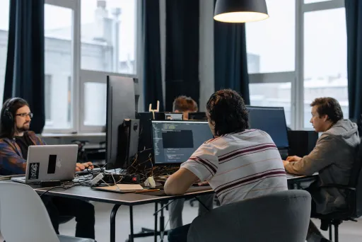 Software team working together in an office on development planning
